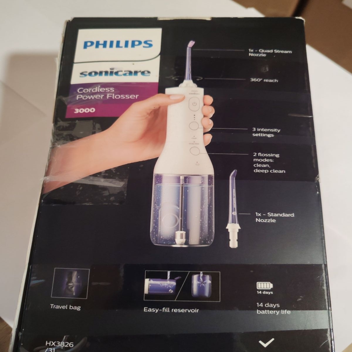 Dus bucal Philips Sonicare cu tehnologie QuadStream, portabil, 2 moduri de curatare, e niveluri de intensitate , include 2 x capete de curatare si 1